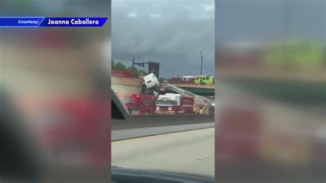 Truck driver rescued after crash leaves cab dangling off Turnpike overpass in Palm Beach Gardens